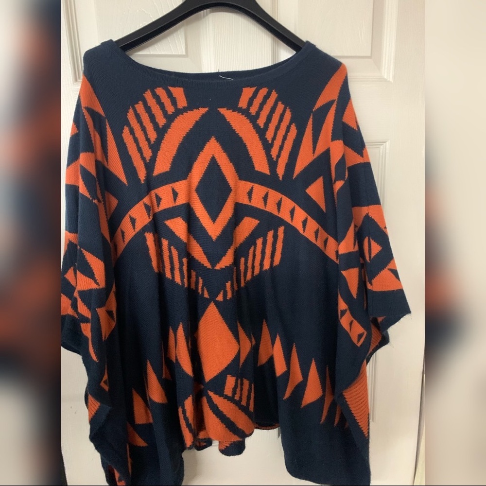Lightly worn orange and blue knit poncho sweater.